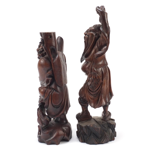 975 - Two Chinese root carvings including one of a fisherman, the largest 44cm high