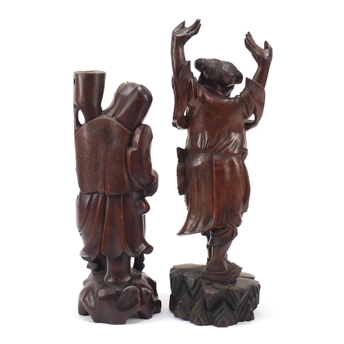 975 - Two Chinese root carvings including one of a fisherman, the largest 44cm high