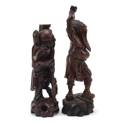 975 - Two Chinese root carvings including one of a fisherman, the largest 44cm high