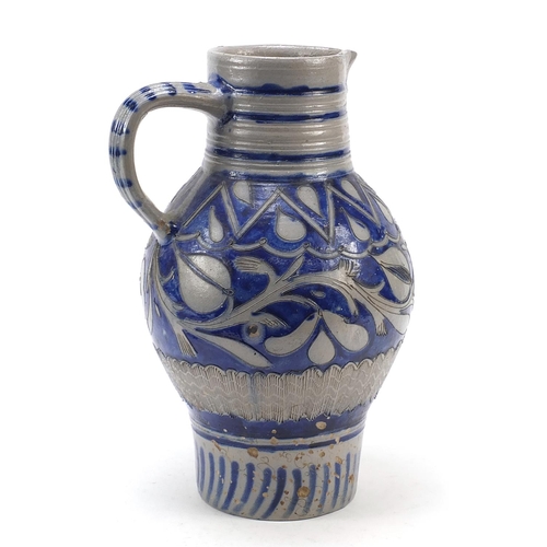 138 - Early 19th century Cologne ware jug decorated and incised with stylised foliage onto a cobalt blue g... 