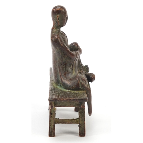 1916 - Chinese bronze monk seated on a bench, 6.5cm wide