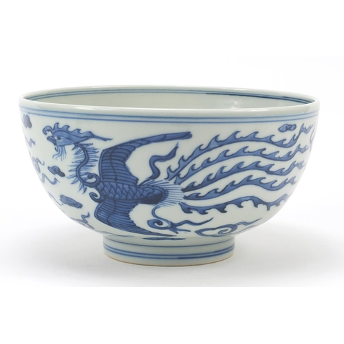 958 - Chinese blue and white porcelain bowl hand painted with a dragon and phoenix amongst clouds chasing ... 