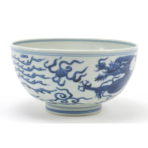 958 - Chinese blue and white porcelain bowl hand painted with a dragon and phoenix amongst clouds chasing ... 