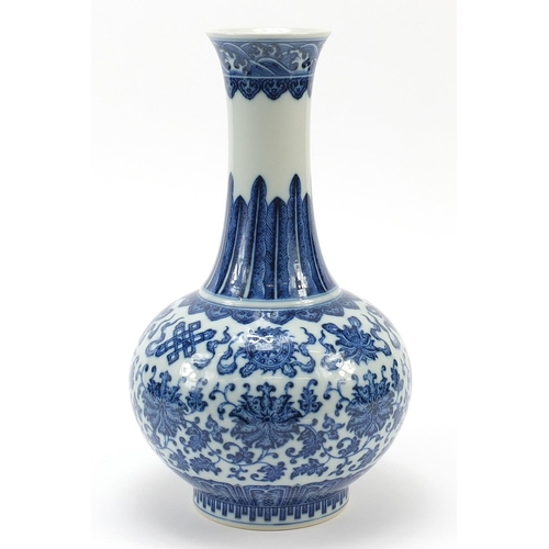 559 - Chinese blue and white porcelain vase finely hand painted with Daoist emblems above flower heads and... 