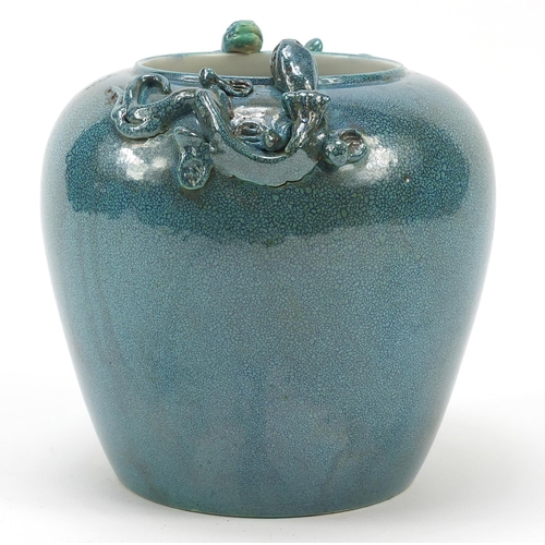 963 - Chinese porcelain jar having a spotted turquoise glaze, decorated in relief with two water dragons, ... 