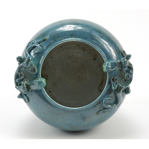 963 - Chinese porcelain jar having a spotted turquoise glaze, decorated in relief with two water dragons, ... 