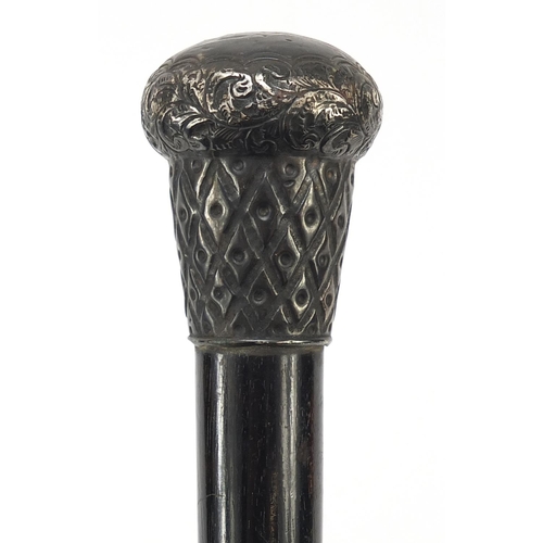 393 - Victorian ebonised walking stick with embossed silver pommel, London 1894, 85cm in length