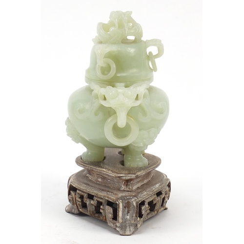 37 - Chinese carved green jade tripod censer with ring turned dragon handles on carved hardwood stand, ov... 
