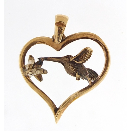 272 - 9ct gold pendant in the form of a hummingbird and flower within a love heart, set with a diamond and... 