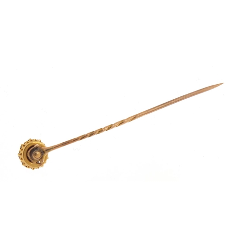 323 - Victorian unmarked gold, diamond and pearl tie pin with unmarked gold lapel mount, housed in a Arthu... 