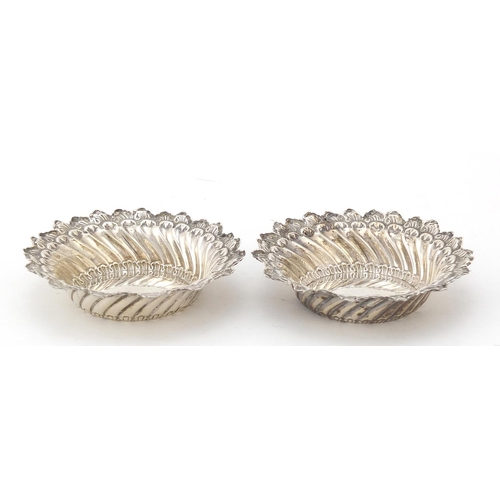 622 - James Deakin & Sons, pair of Victorian circular silver dishes embossed with foliage, Chester 1894, 9... 