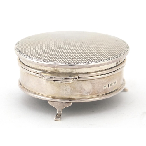 134 - Adie Brothers Ltd, circular silver jewel box, the hinged lid with engine turned decoration, raised o... 