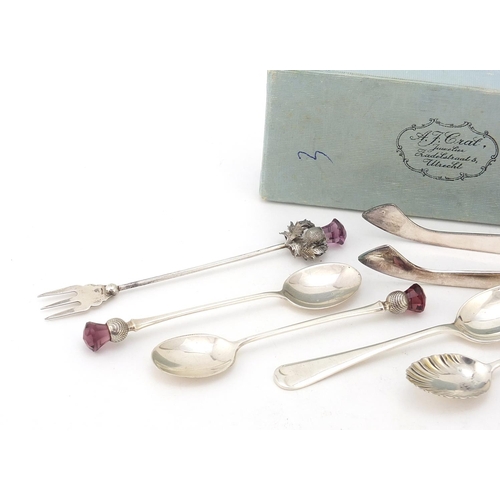 840 - Silver items including an Edwardian silver easel photo frame, pair of German sugar tongs and teaspoo... 