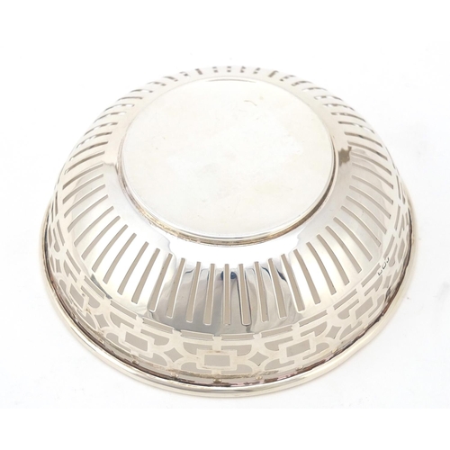 133 - Boots Pure Drug Company, George V circular silver pierced bowl, Birmingham 1911, 13cm in diameter, 8... 