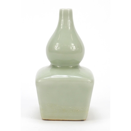 828 - Chinese porcelain double gourd vase having a celadon glaze, six figure character marks to the base, ... 