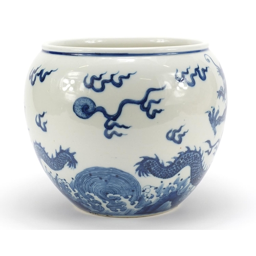 955 - Good Chinese blue and white porcelain jardinière hand painted with dragons chasing a flaming pearl a... 