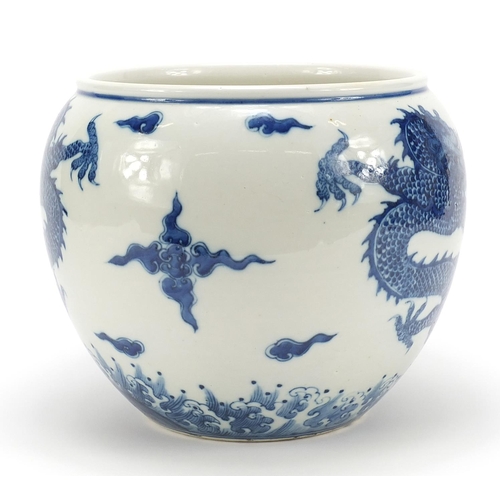 955 - Good Chinese blue and white porcelain jardinière hand painted with dragons chasing a flaming pearl a... 