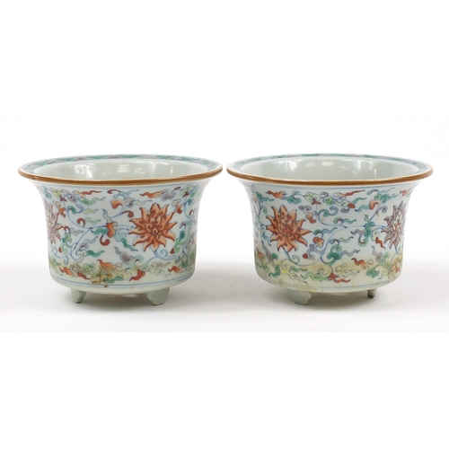 94 - Pair of Chinese doucai porcelain three footed planters hand painted with flowers amongst scrolling f... 