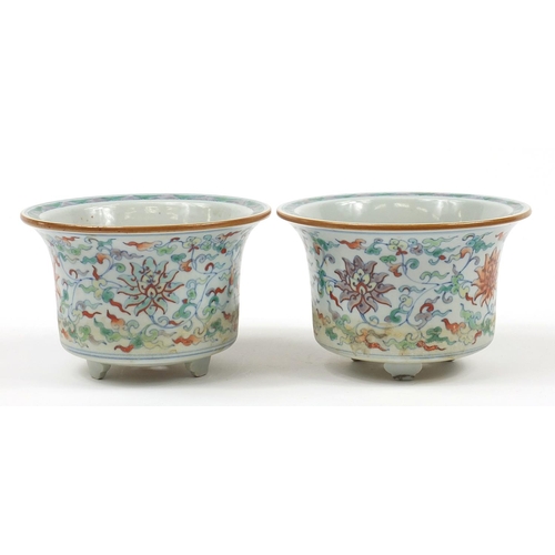 94 - Pair of Chinese doucai porcelain three footed planters hand painted with flowers amongst scrolling f... 