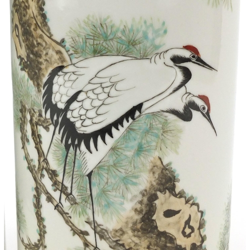 660 - Pair of Chinese porcelain cylindrical vases hand painted with cranes amongst pine trees, 28.5cm high