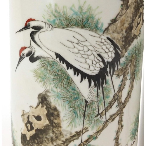 660 - Pair of Chinese porcelain cylindrical vases hand painted with cranes amongst pine trees, 28.5cm high