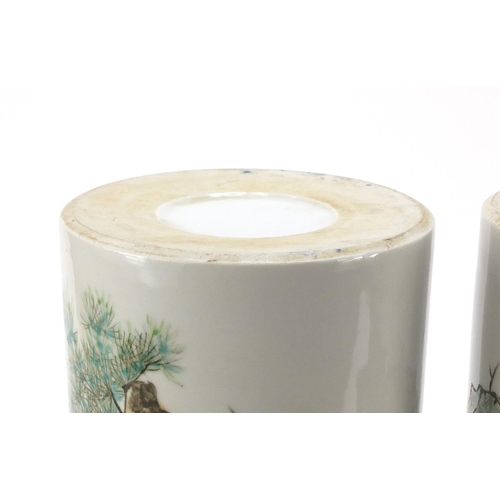 660 - Pair of Chinese porcelain cylindrical vases hand painted with cranes amongst pine trees, 28.5cm high