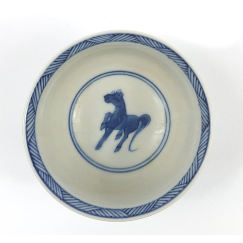 818 - Chinese blue and white porcelain tea bowl and saucer hand painted with horses, the largest 11.5cm in... 