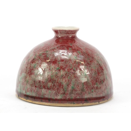 962 - Chinese porcelain beehive water pot having a sang de boeuf glaze, 9.5cm high