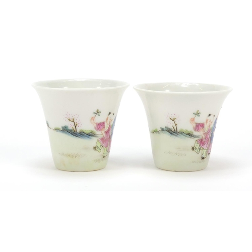 911 - Good pair of Chinese porcelain tea cups hand painted in the famille rose palette with children playi... 