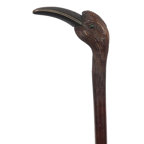 391 - 19th/20th century century silk parasol with carved wood handle in the form of a bird with horn beak ... 