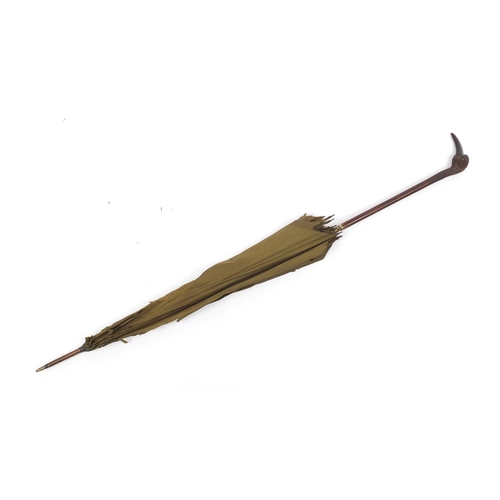 391 - 19th/20th century century silk parasol with carved wood handle in the form of a bird with horn beak ... 