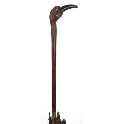 391 - 19th/20th century century silk parasol with carved wood handle in the form of a bird with horn beak ... 