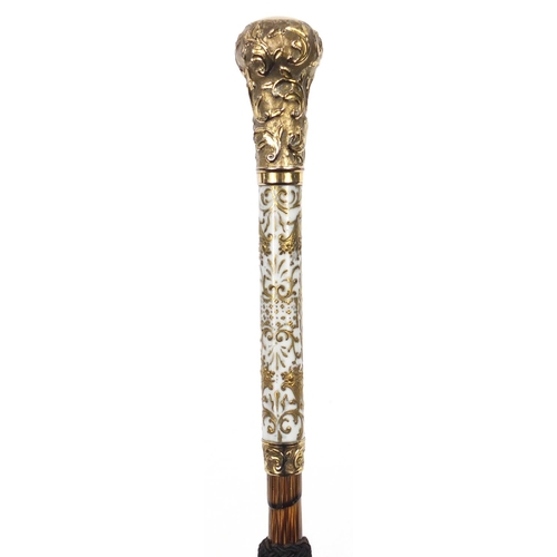 395 - Good 19th century parasol with embossed gilt metal mounts and porcelain handle decorated with a port... 