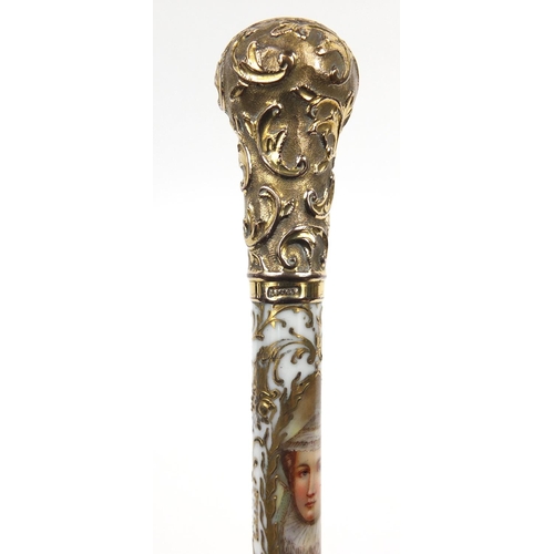 395 - Good 19th century parasol with embossed gilt metal mounts and porcelain handle decorated with a port... 