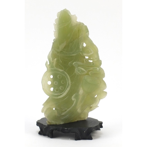 355 - Chinese green hardstone carving of Guan Yin on stand, overall 22cm high