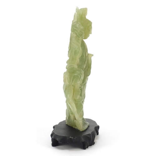 355 - Chinese green hardstone carving of Guan Yin on stand, overall 22cm high