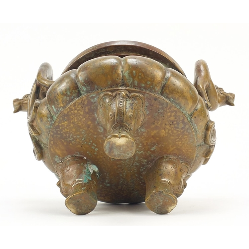 571 - Chinese patinated bronze tripod incense burner with twin dragon handles, six figure character marks ... 