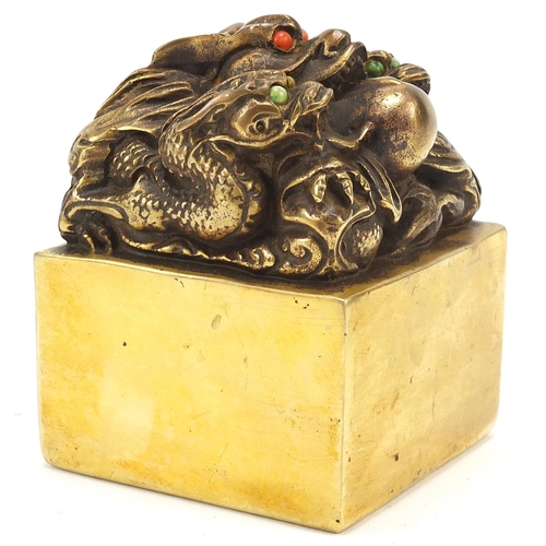 103 - Large Chinese bronze dragon seal, four figure character marks to the base, 9.5cm high