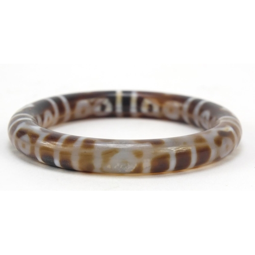 444 - Tibetan hardstone bangle, 7.5cm in diameter