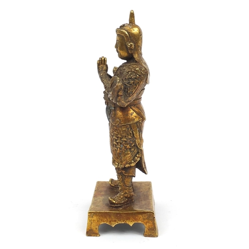 665 - Chino-Tibetan gilt bronze figure of a warrior, 23.5cm high