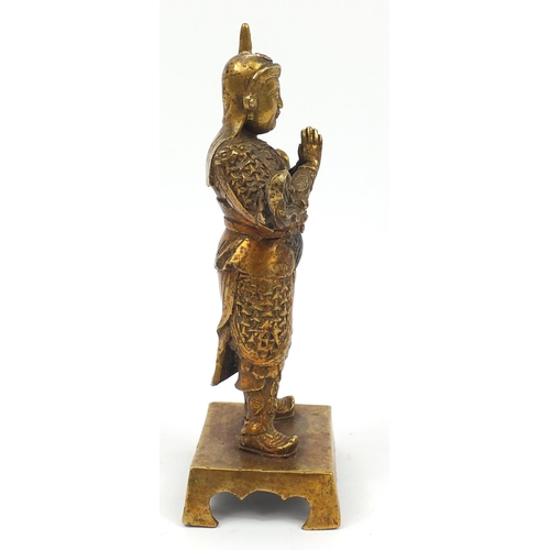 665 - Chino-Tibetan gilt bronze figure of a warrior, 23.5cm high