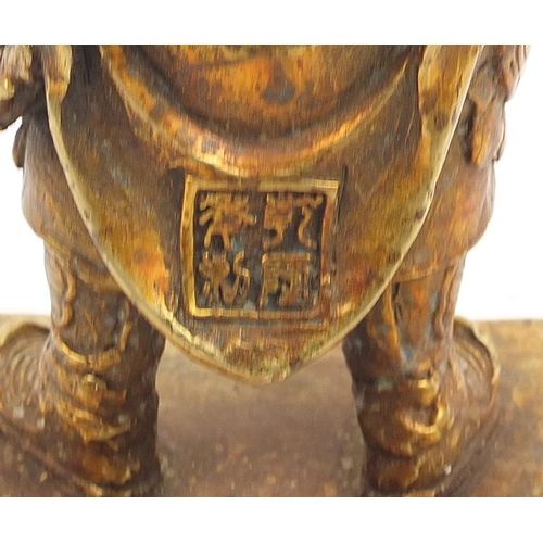 665 - Chino-Tibetan gilt bronze figure of a warrior, 23.5cm high