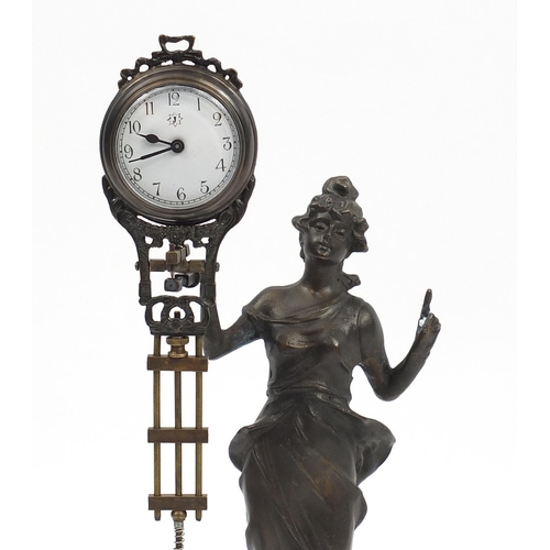 516 - Art Nouveau design figural mystery clock in the form of a maiden, 33.5cm high