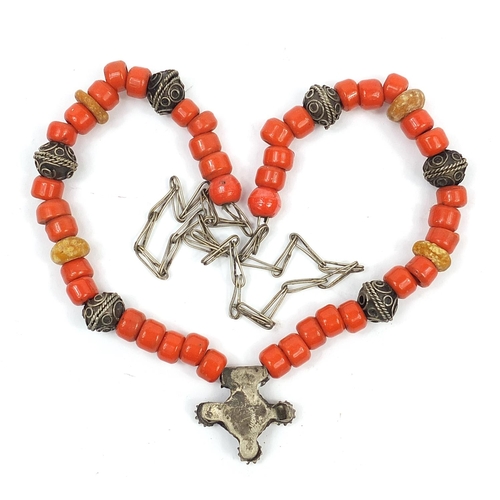 447 - Middle Eastern silver coloured metal and coral coloured bead necklace, 60cm in length