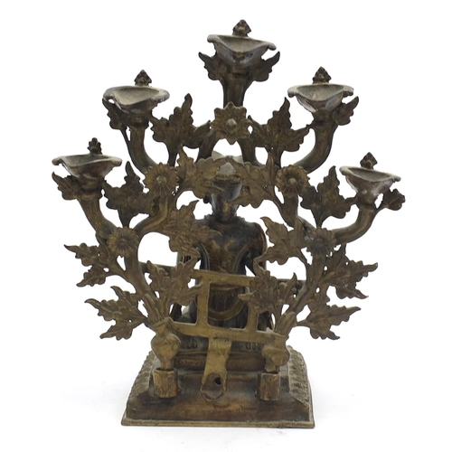 190 - Tibetan two piece patinated bronze figural incense stand, 23cm high