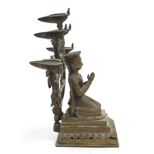 190 - Tibetan two piece patinated bronze figural incense stand, 23cm high