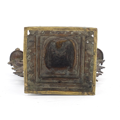 190 - Tibetan two piece patinated bronze figural incense stand, 23cm high