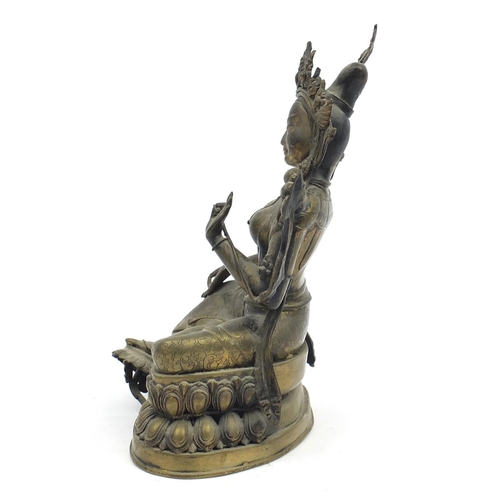 102 - Chino-Tibetan patinated bronze figure of seated Buddha, 32cm high