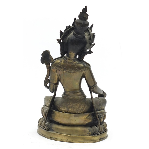 102 - Chino-Tibetan patinated bronze figure of seated Buddha, 32cm high