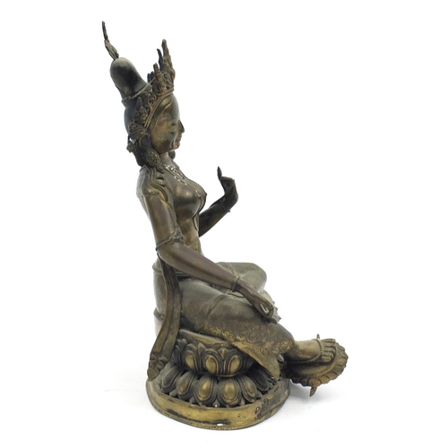 102 - Chino-Tibetan patinated bronze figure of seated Buddha, 32cm high